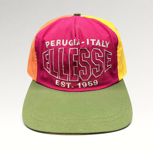 Raree Finds vintage 90s Ellesse snapback hat in magenta, yellow, orange, and olive nylon with Perugia Italy embroidery.