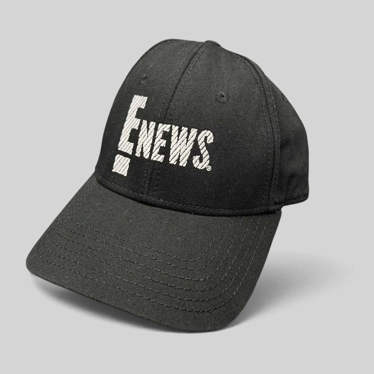 Raree Finds vintage black OTTO Cap snapback hat featuring an embroidered white E! News logo on the front