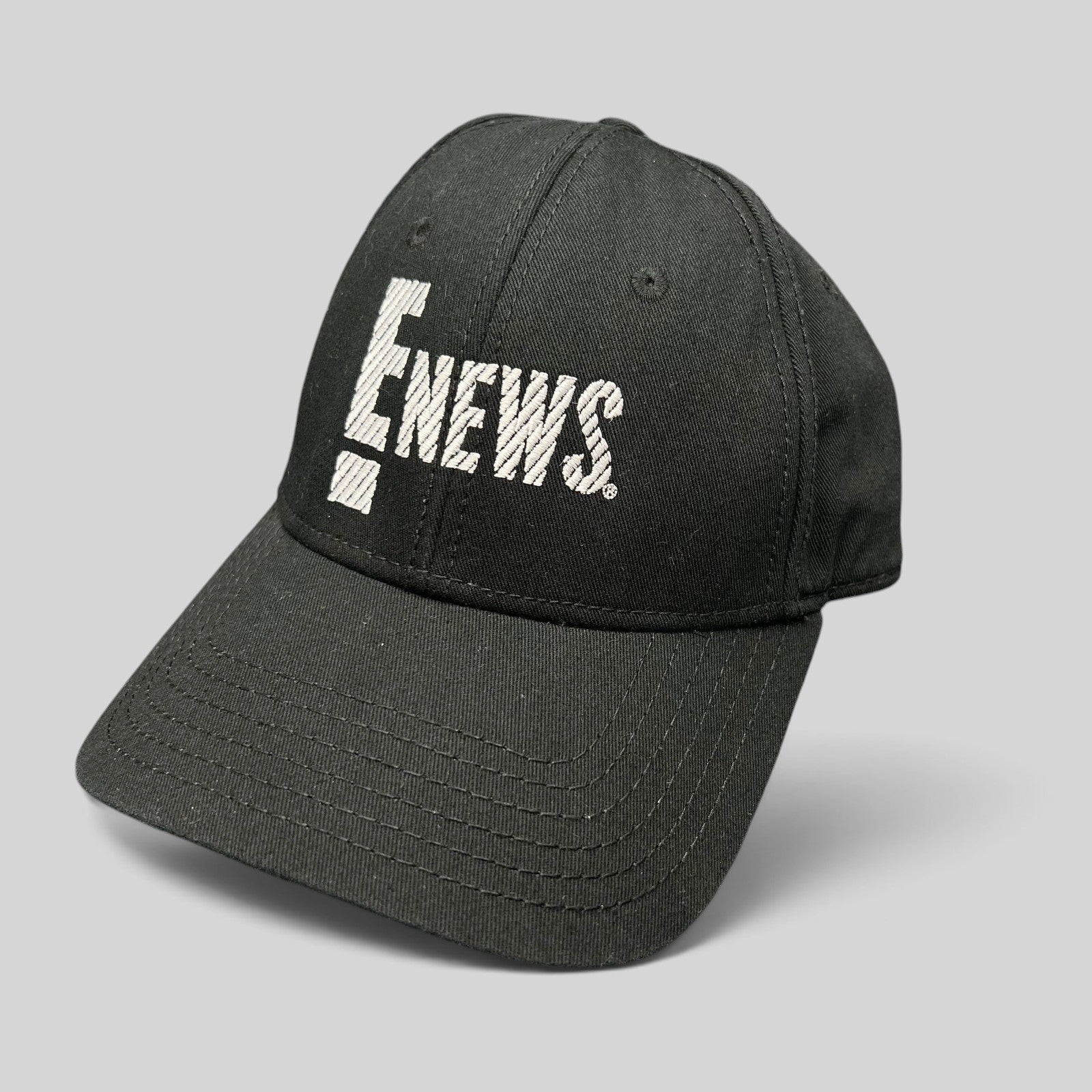 Raree Finds vintage black OTTO Cap snapback hat featuring an embroidered white E! News logo on the front