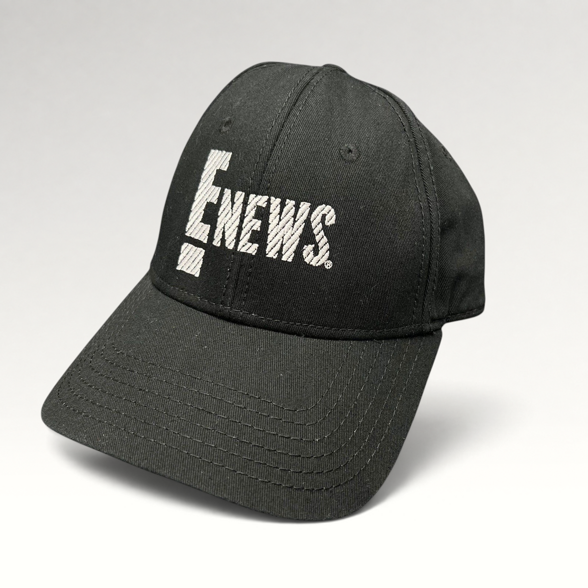 Raree Finds vintage black OTTO Cap snapback hat featuring an embroidered white E! News logo on the front