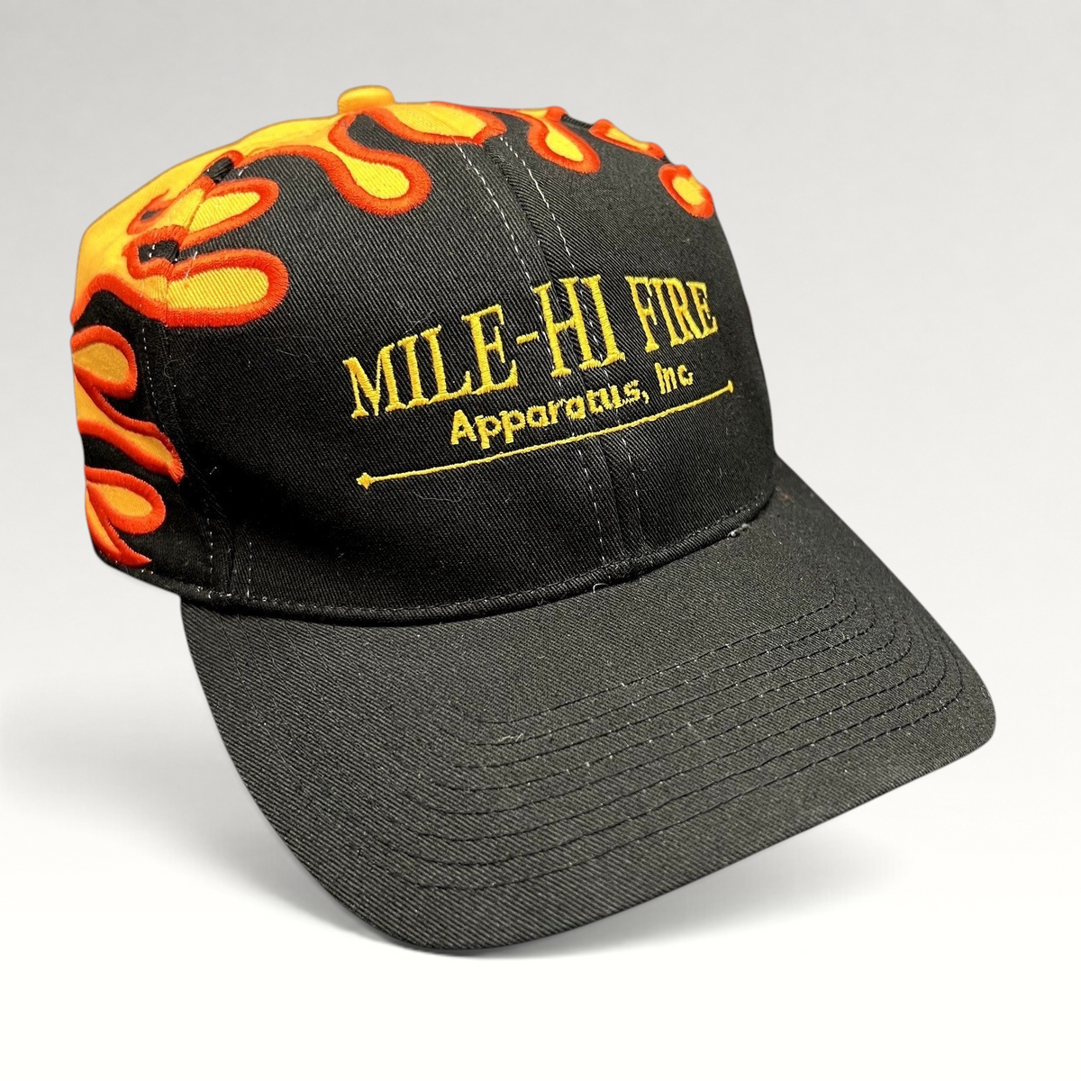 Raree Finds vintage Mile-Hi Fire Apparatus strapback hat with black cotton fabric and embroidered flame design.