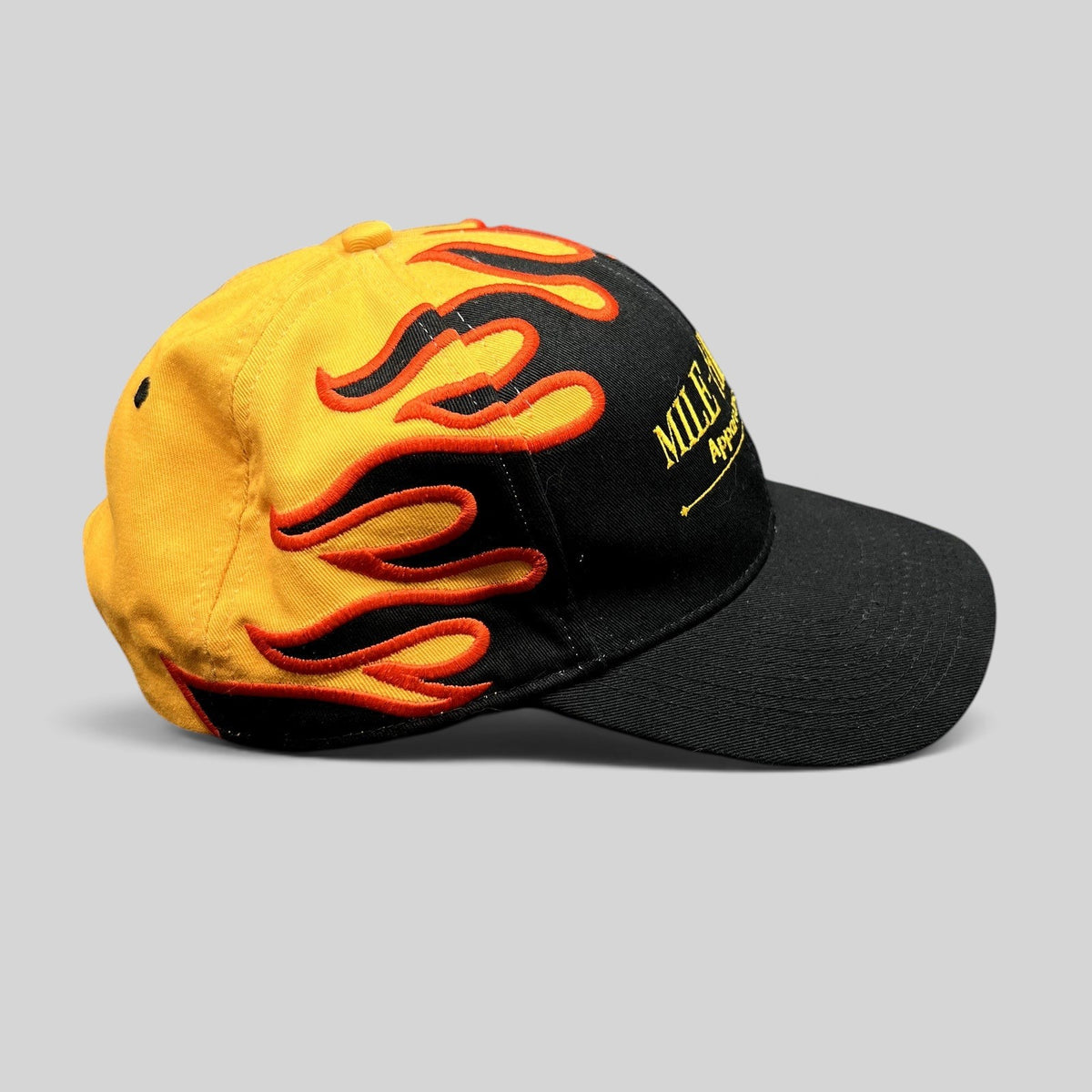 Raree Finds vintage Mile-Hi Fire Apparatus strapback hat with black brim and yellow crown featuring red flame embroidery
