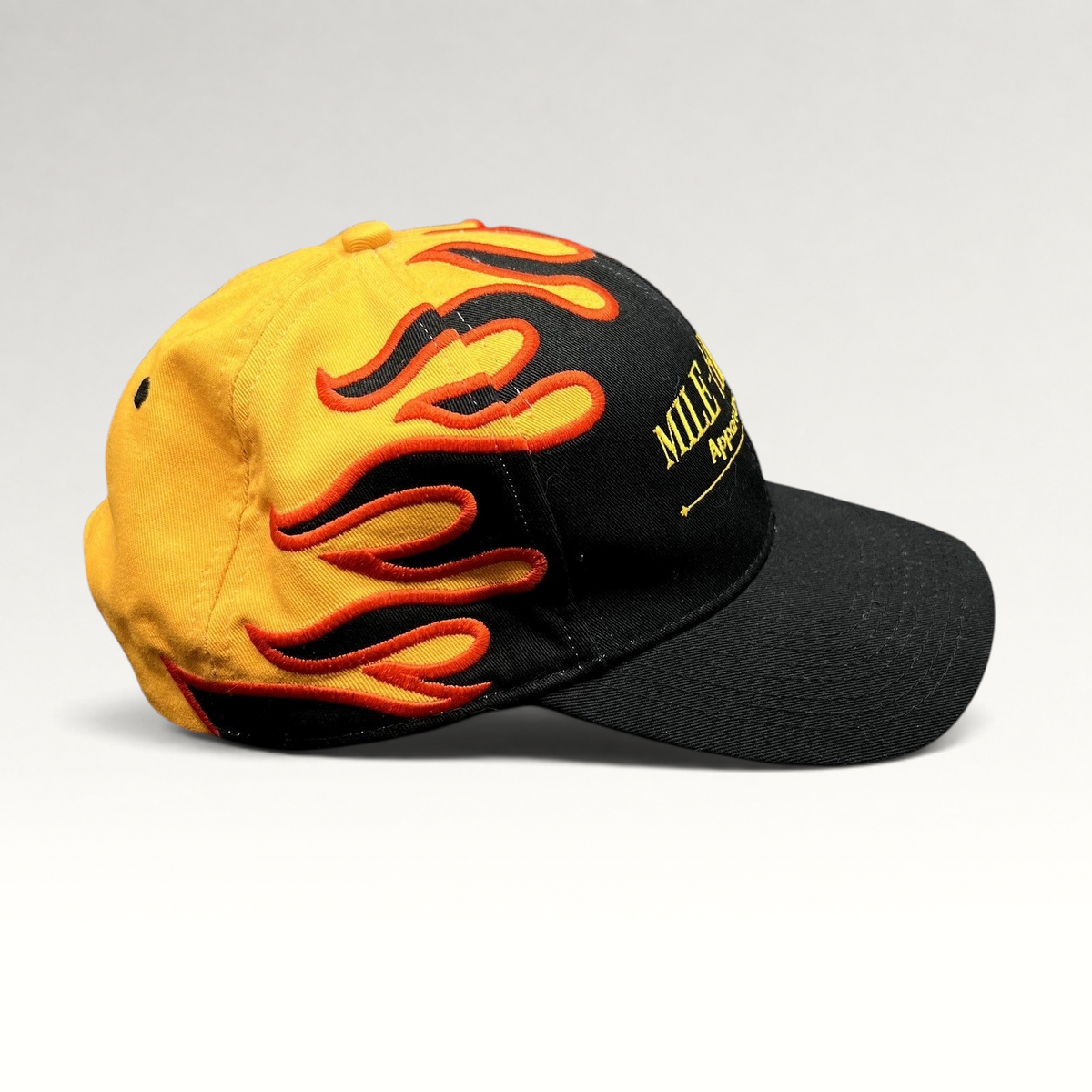 Raree Finds vintage Mile-Hi Fire Apparatus strapback hat with black brim and yellow crown featuring red flame embroidery