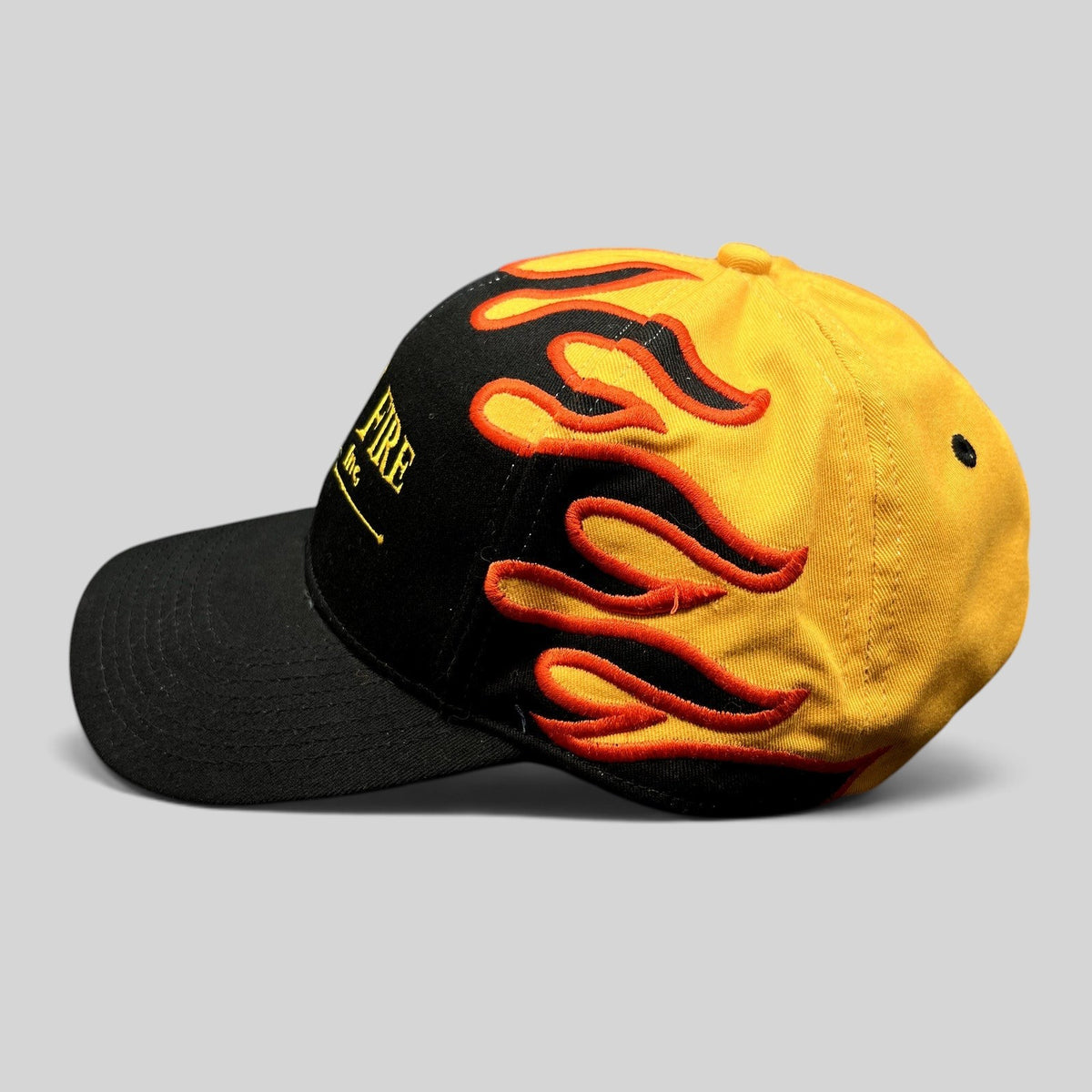 Raree Finds vintage Mile-Hi Fire Apparatus strapback hat with black brim and yellow crown featuring red flame embroidery