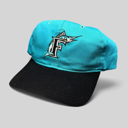Raree Finds vintage Florida Marlins snapback hat with teal crown, black brim, and embroidered F logo.