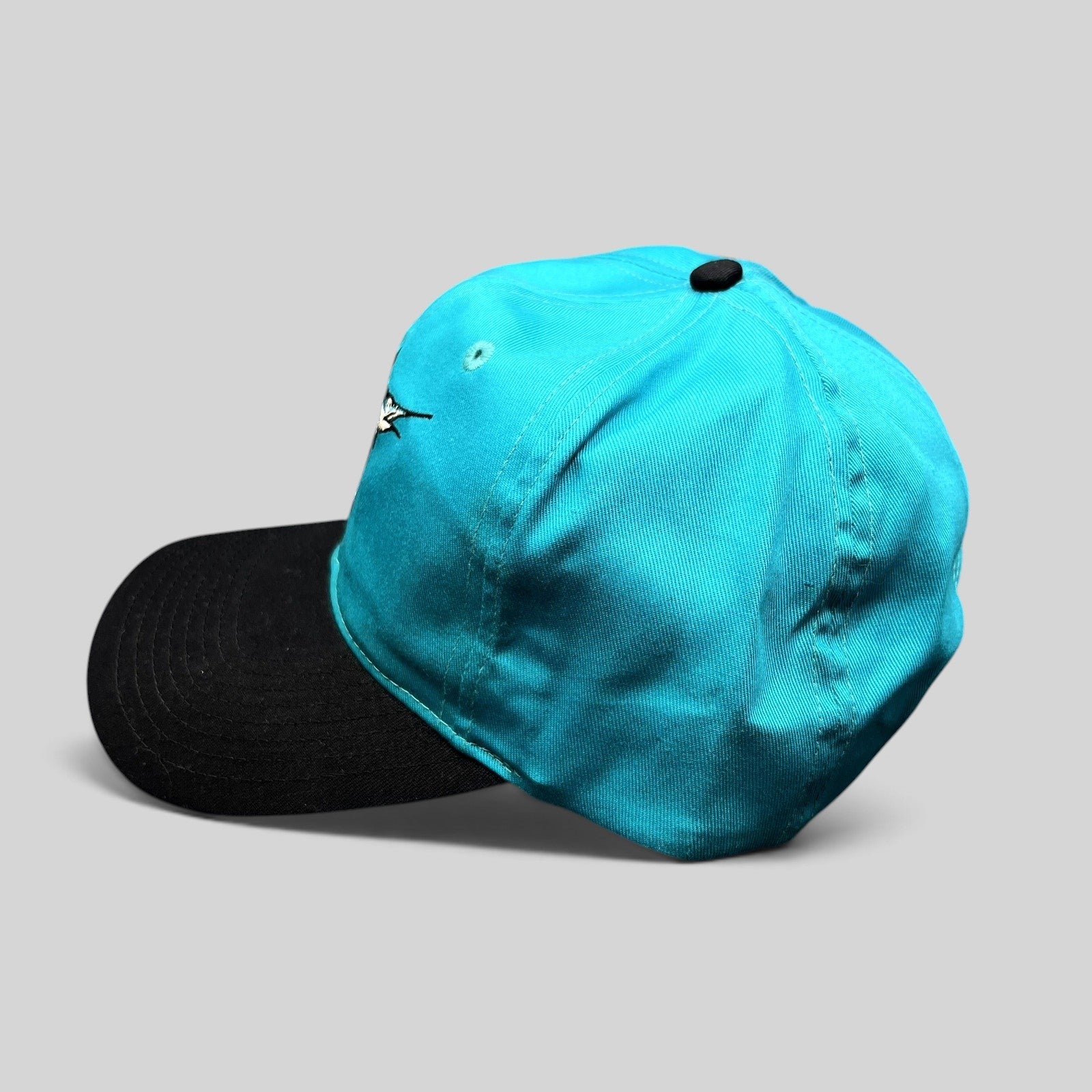 Raree Finds vintage Florida Marlins snapback hat in teal with a black brim and embroidered logo