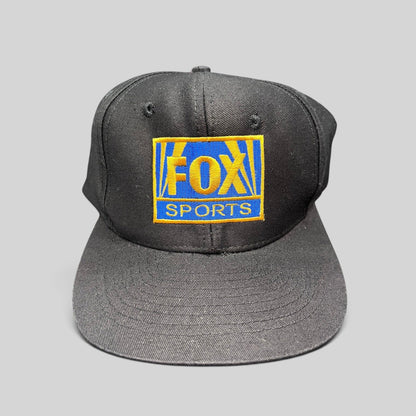 Raree Finds vintage 90s FOX Sports black cotton snapback hat with gold and royal blue embroidered logo