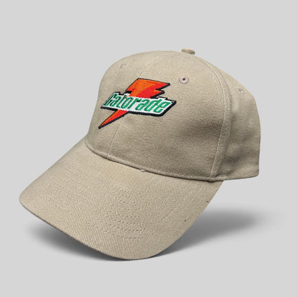 Raree Finds vintage beige Cap America strapback hat with embroidered orange and green Gatorade lightning bolt logo