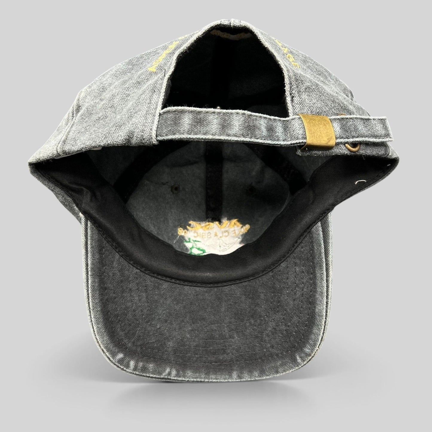 Raree Finds vintage 1998 AVSC Golf Classic Cobra strapback hat in faded black cotton with a brass buckle closure.