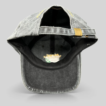 Raree Finds vintage 1998 AVSC Golf Classic Cobra strapback hat in faded black cotton with a brass buckle closure.