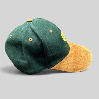 Raree Finds vintage Desert Lake golf strapback hat with a forest green cotton crown and tan suede-style brim.