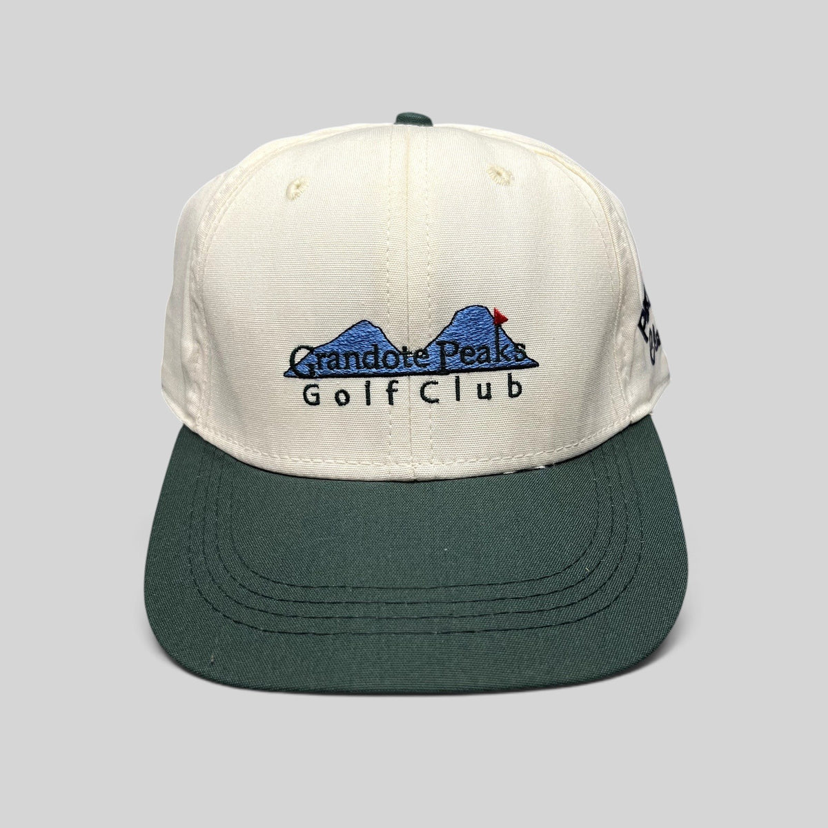 Raree Finds vintage 1997 Imperial Headwear two-tone white and green golf hat with Grandote Peaks Golf Club embroidery
