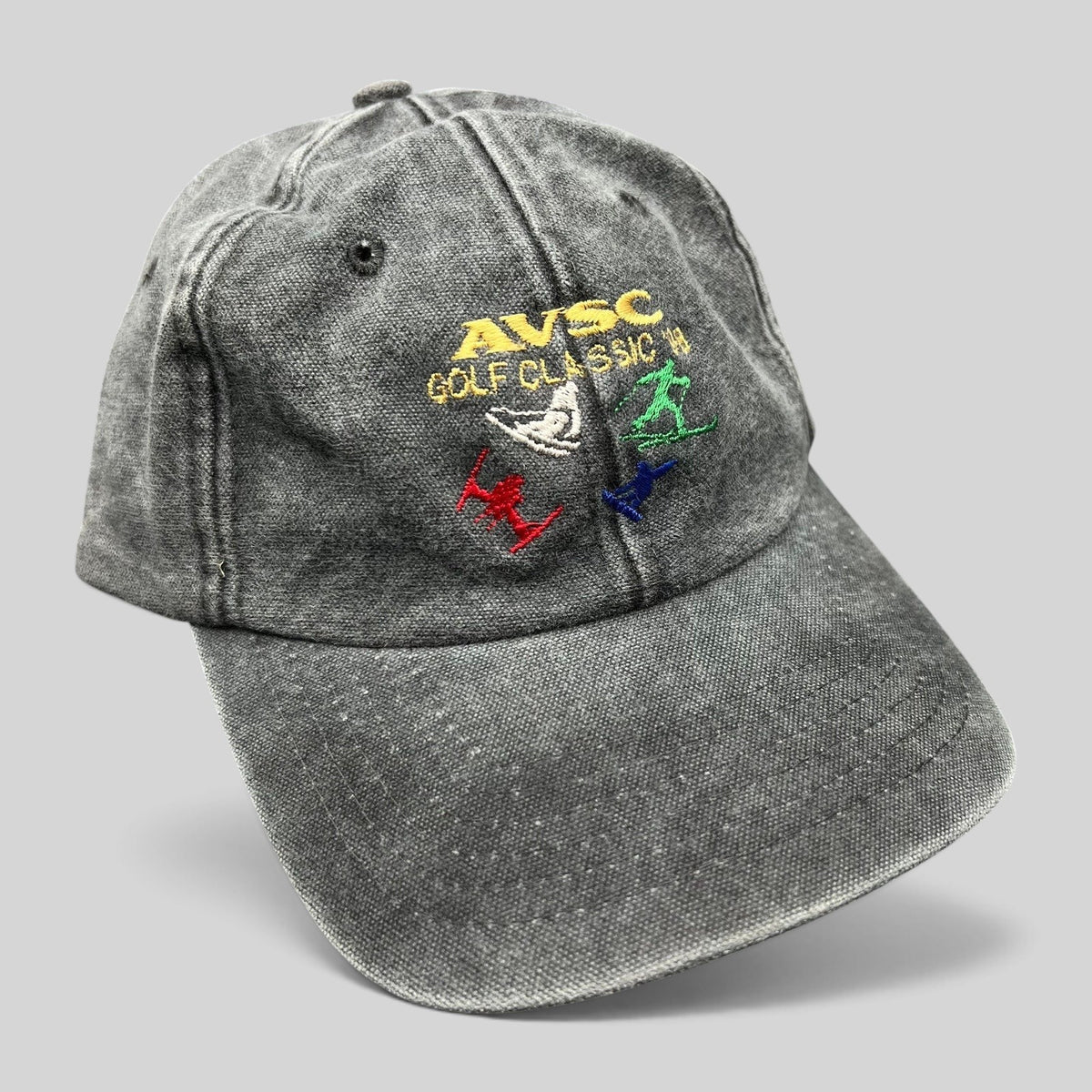 Raree Finds vintage 1998 AVSC Golf Classic faded black cotton dad hat with colorful embroidered golfer graphics.