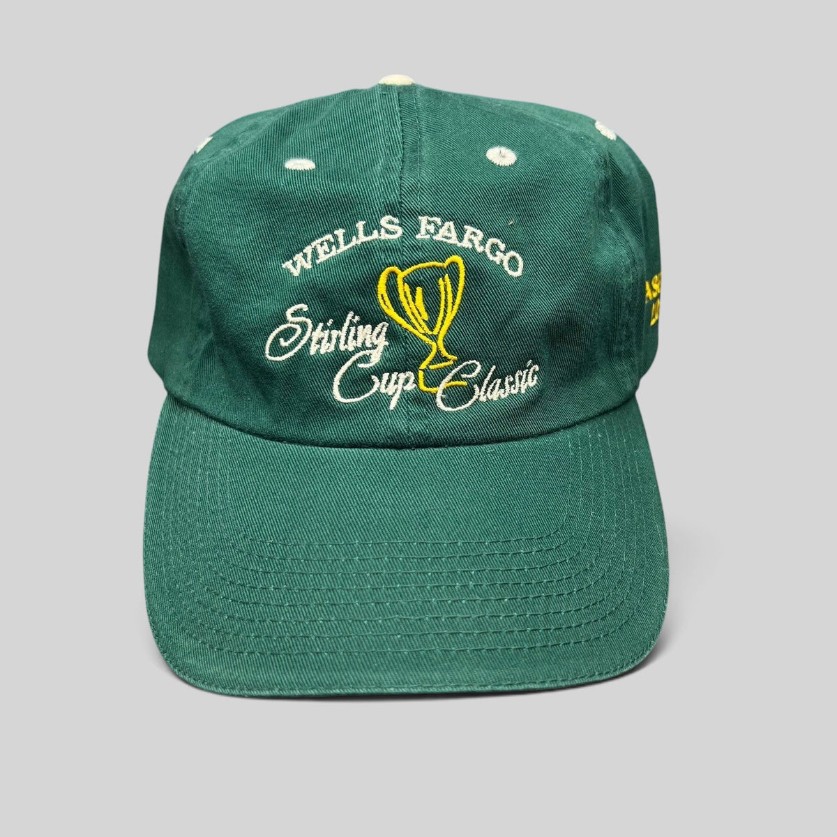 Raree Finds vintage green cotton strapback golf hat featuring Wells Fargo Sterling Cup Classic trophy embroidery.