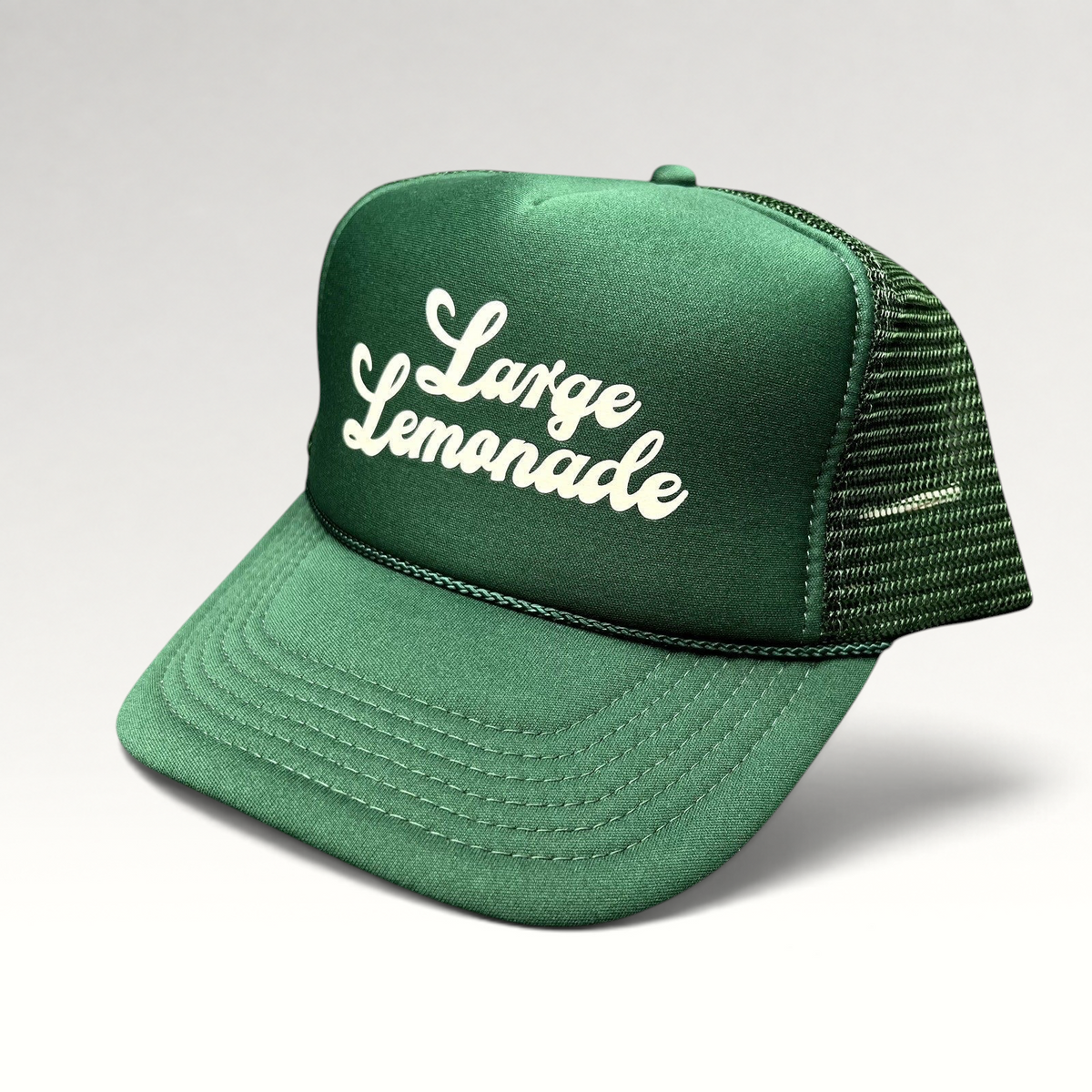 Raree Finds vintage green foam trucker hat with white Large Lemonade script logo, mesh back, and braided rope detail.