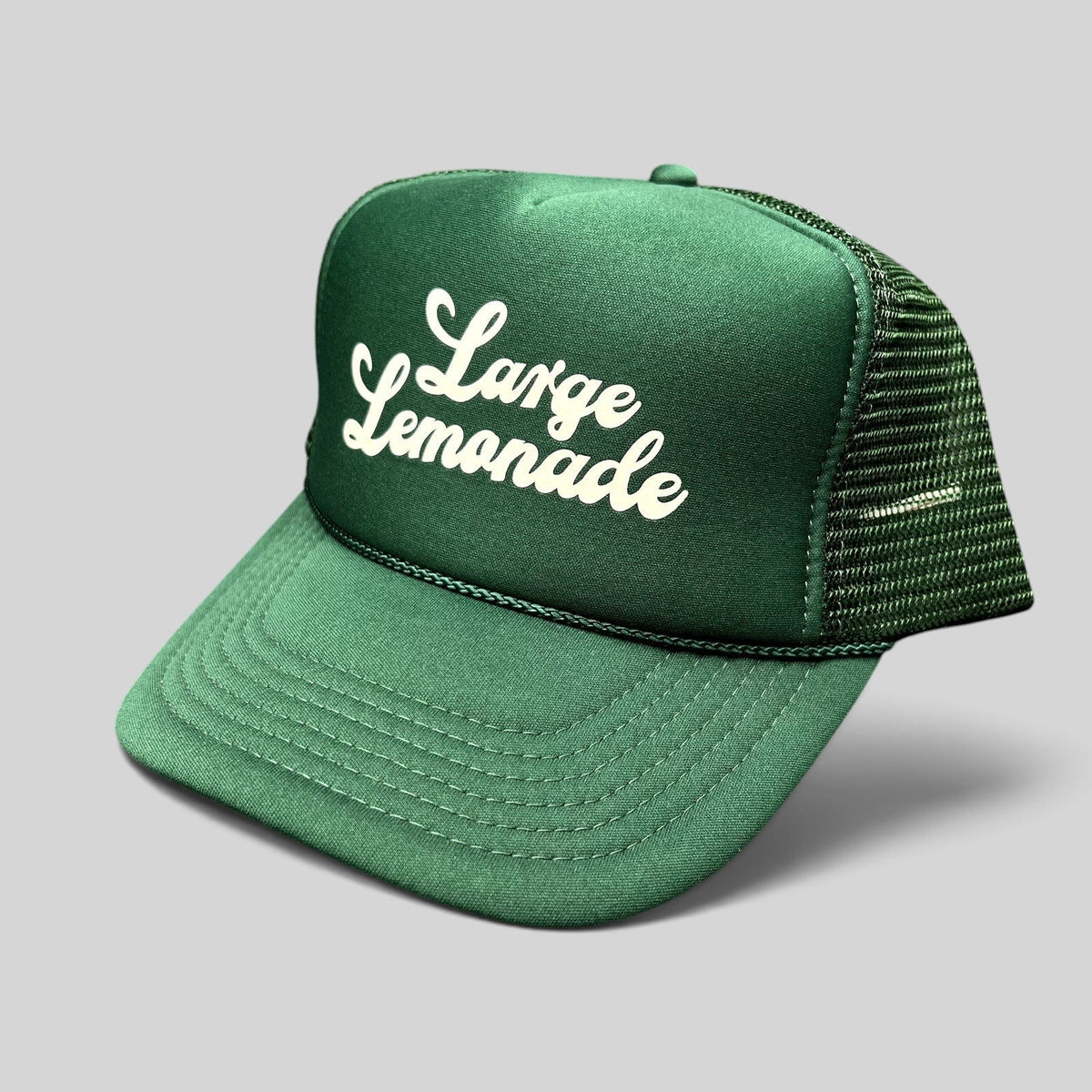 Raree Finds vintage green foam trucker hat with Large Lemonade white script logo, mesh back, and braided rope detail.