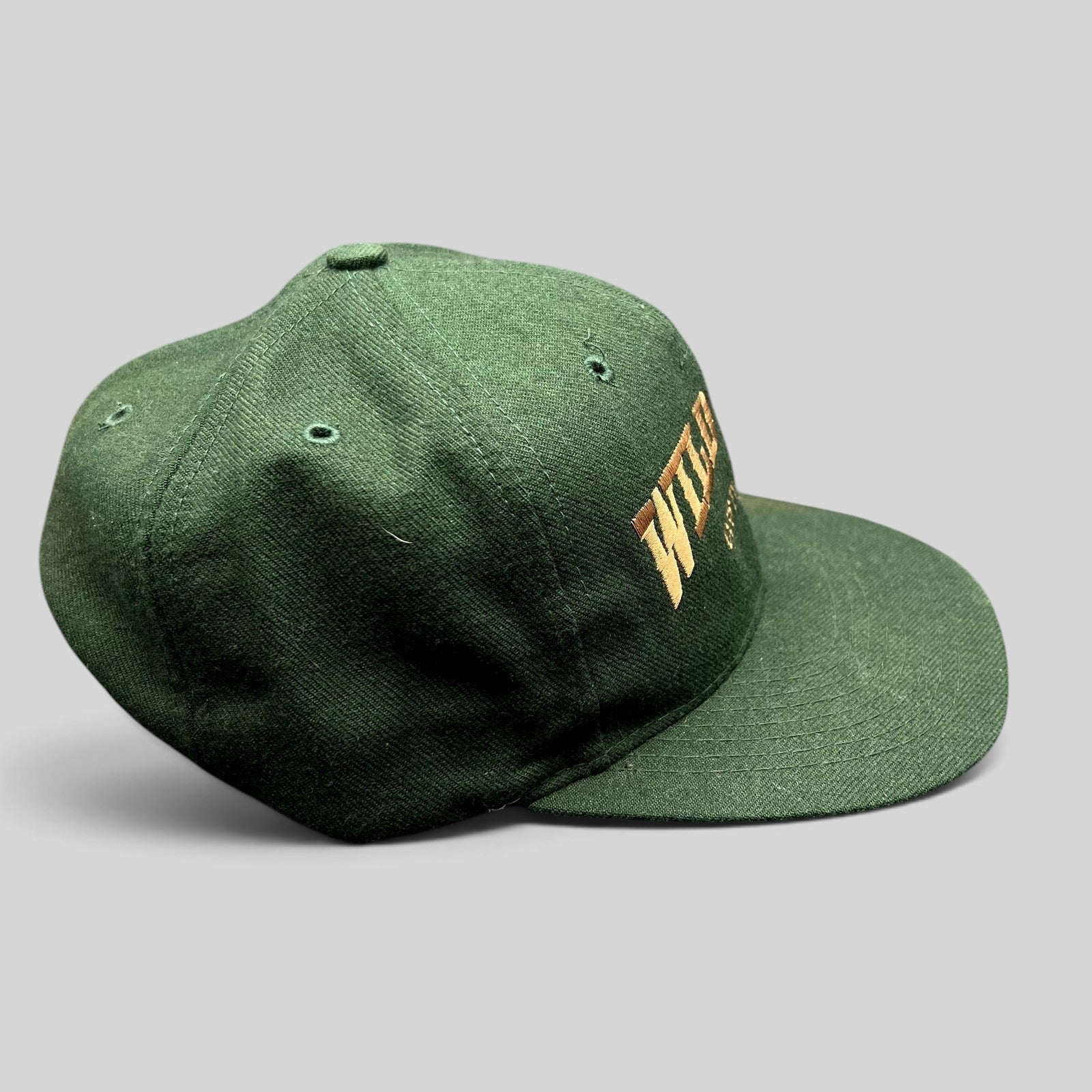 Raree Finds vintage dark green Otto Cap snapback hat with brown Wild Bill Costumes embroidery and flat brim