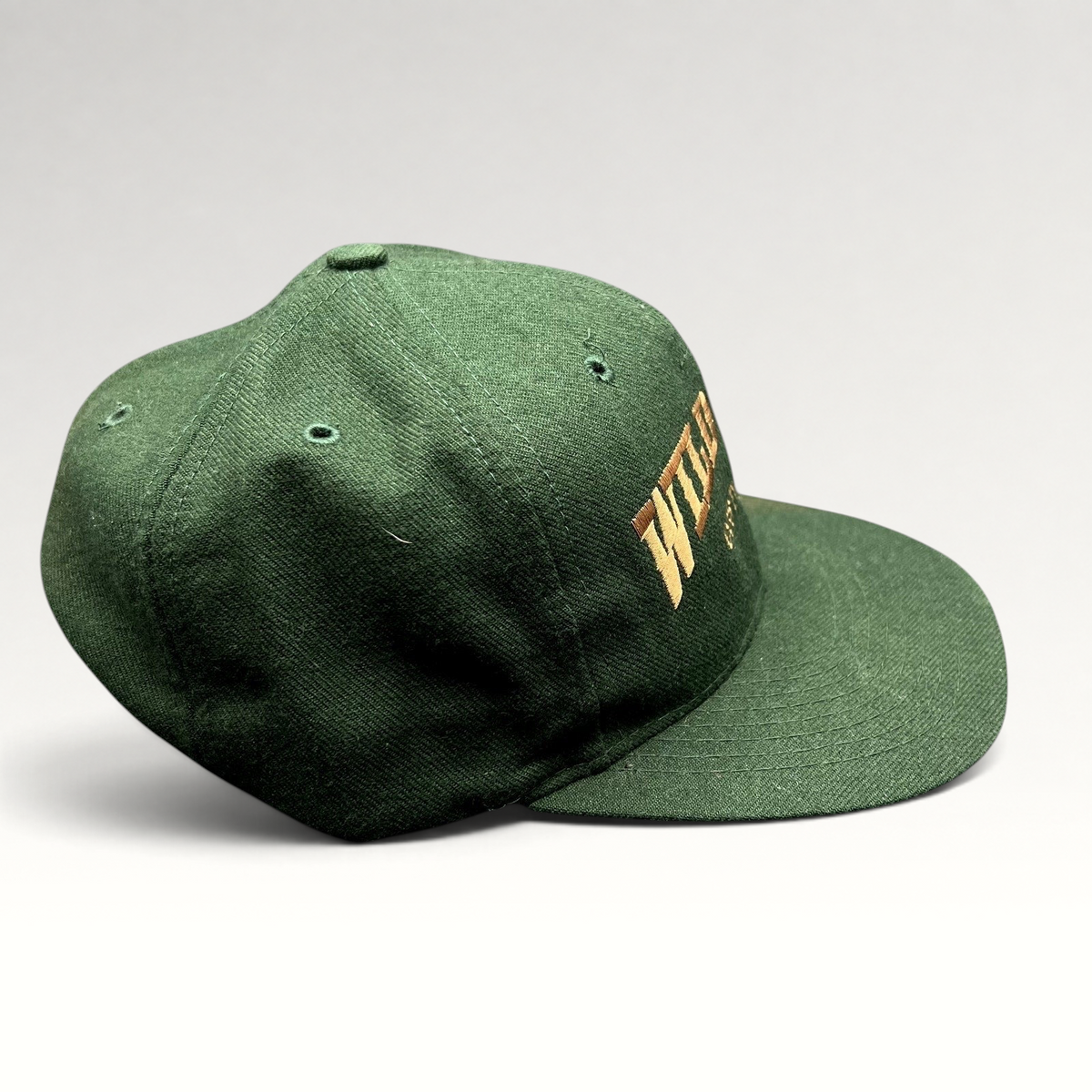 Raree Finds vintage dark green Otto Cap snapback hat with brown Wild Bill Costumes embroidery and flat brim