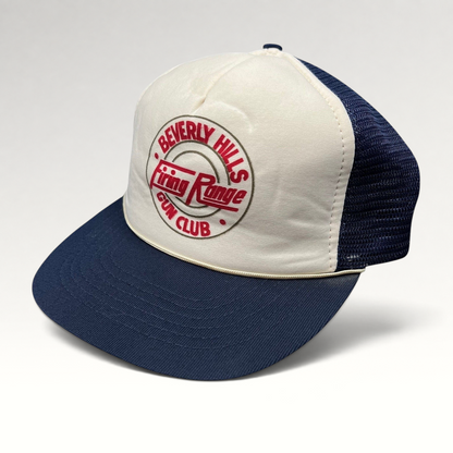 Raree Finds vintage Beverly Hills Gun Club trucker hat with white foam front, navy mesh back, and red graphic print.