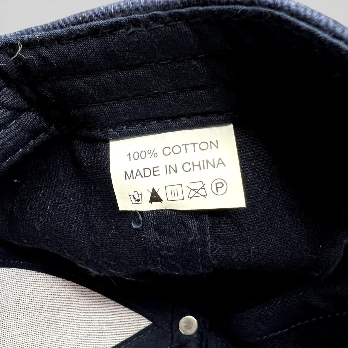 Raree Finds vintage Telluride Film Festival hat interior care label showing 100 percent cotton material and origin
