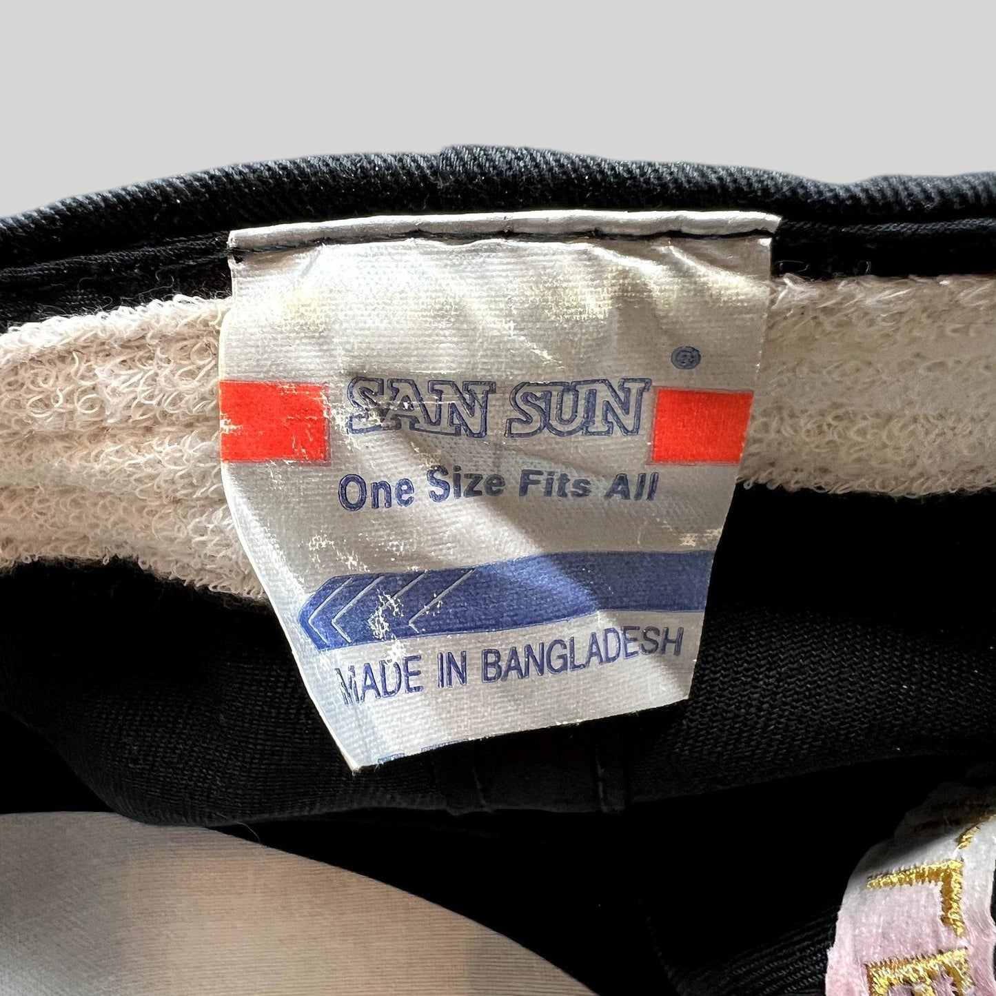 Raree Finds vintage hat interior tag showing San Sun brand, one size fits all, and made in Bangladesh label