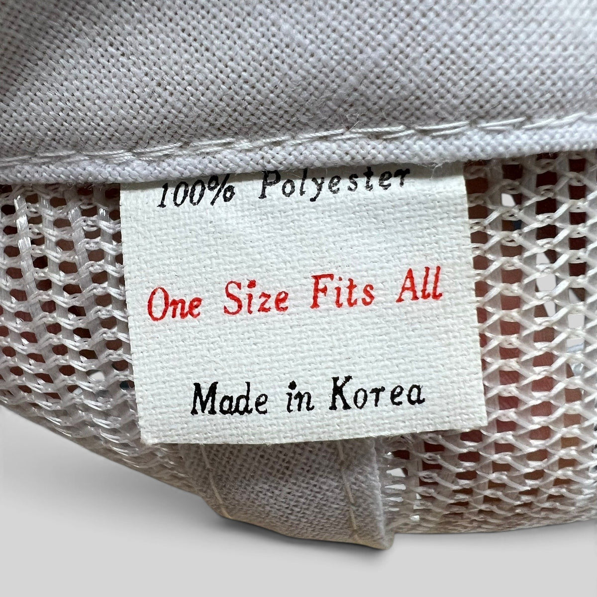 Raree Finds vintage 1980s snapback hat interior tag showing 100% polyester material and made in Korea origin