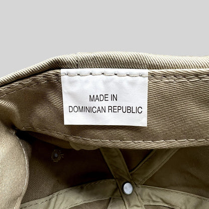 Raree Finds vintage hat interior showing the white fabric tag that reads Made in Dominican Republic on khaki cotton
