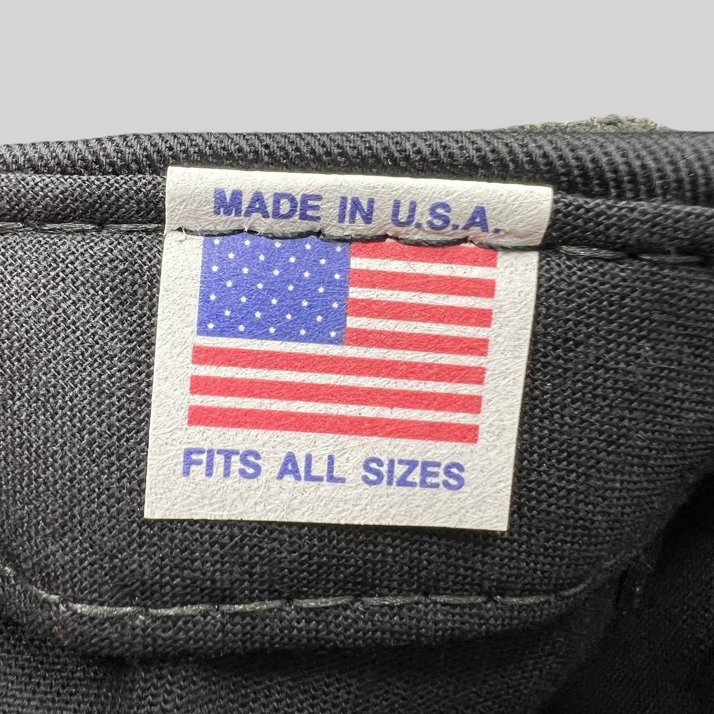 Raree Finds vintage hat interior tag featuring an American flag graphic with Made in U.S.A. and Fits All Sizes text.