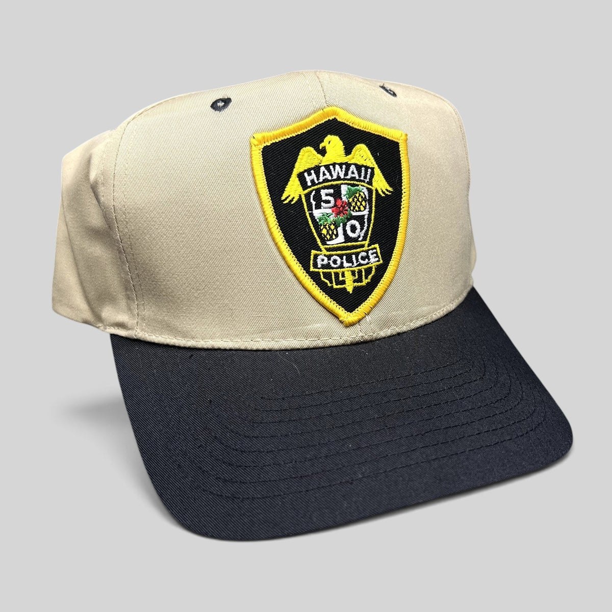Raree Finds vintage Nissin Hawaii 5-0 Police snapback hat in khaki and black with embroidered badge logo.