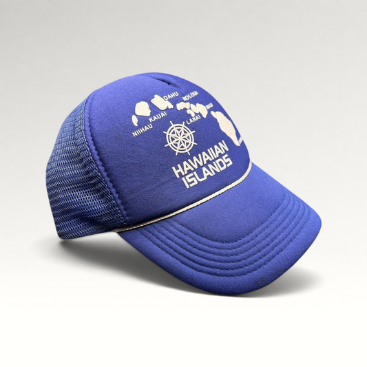 Raree Finds vintage royal blue foam trucker hat with a white Hawaiian Islands map graphic and nautical helm emblem.