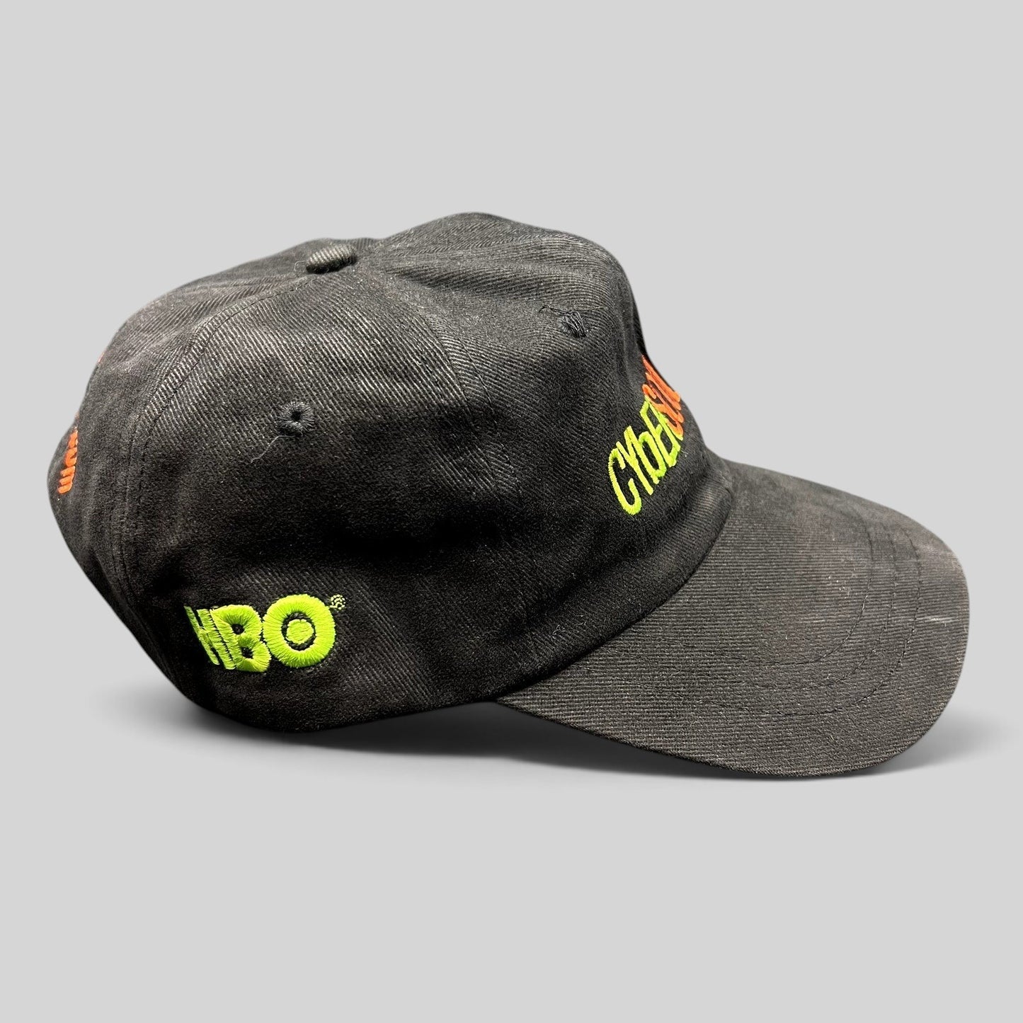 Raree Finds vintage black cotton strapback hat with neon green HBO and CyberSoulCity embroidery in Y2K techwear style