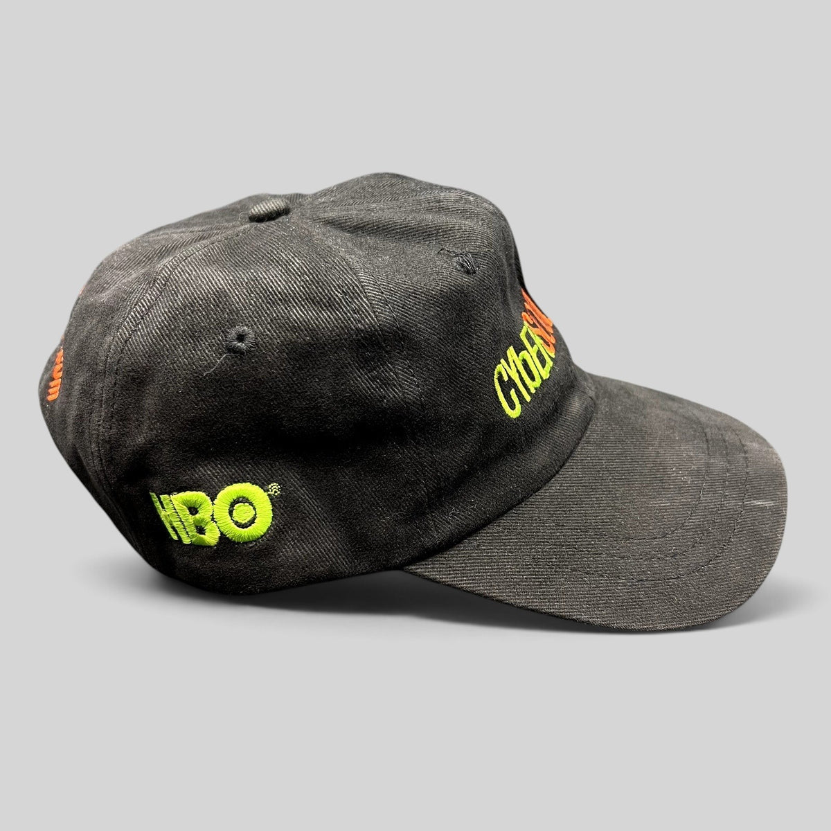 Raree Finds vintage black cotton strapback hat with neon green HBO and CyberSoulCity embroidery in Y2K techwear style