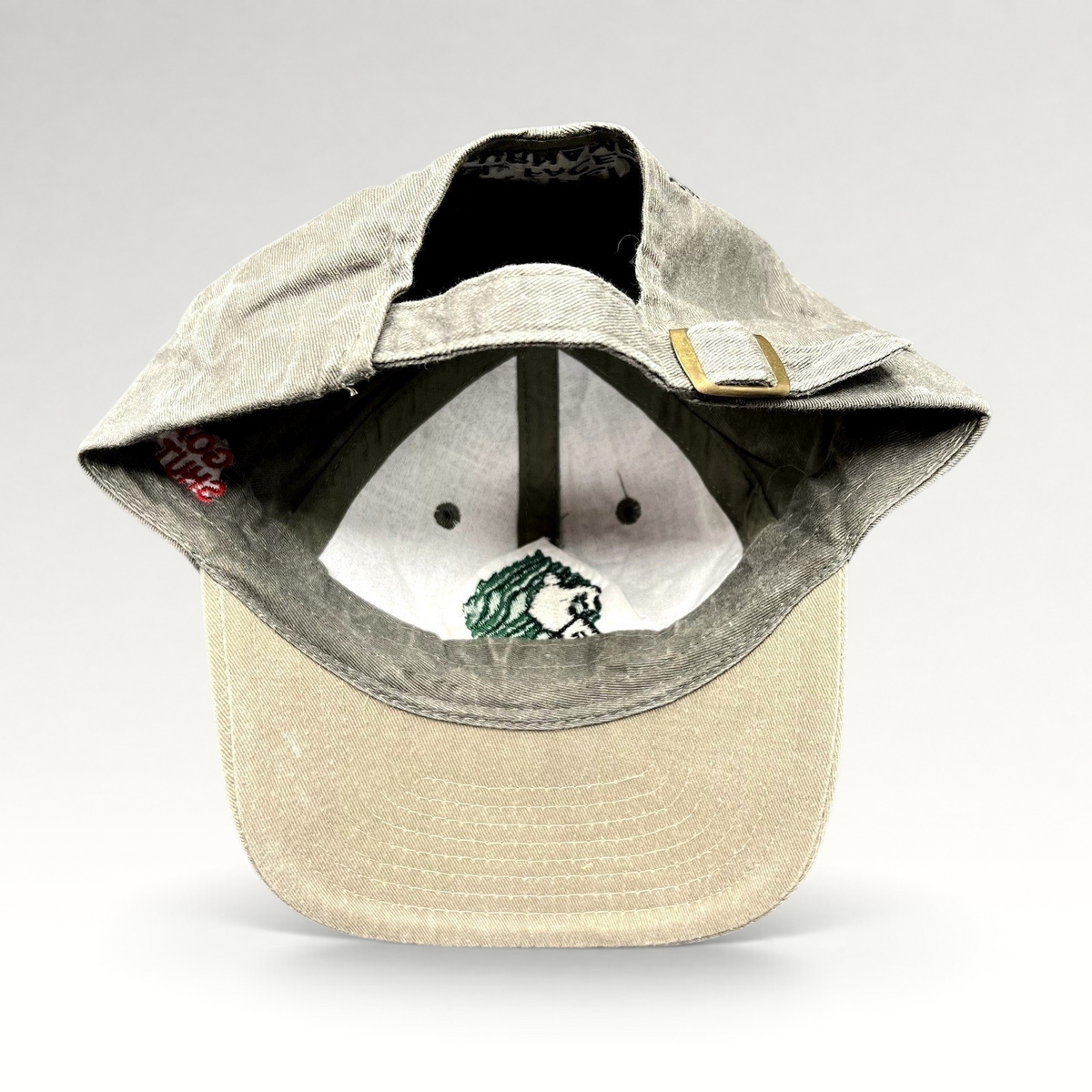 Raree Finds vintage Aspen Fall Face Off hockey strapback hat with olive gray crown, khaki brim, and brass buckle.