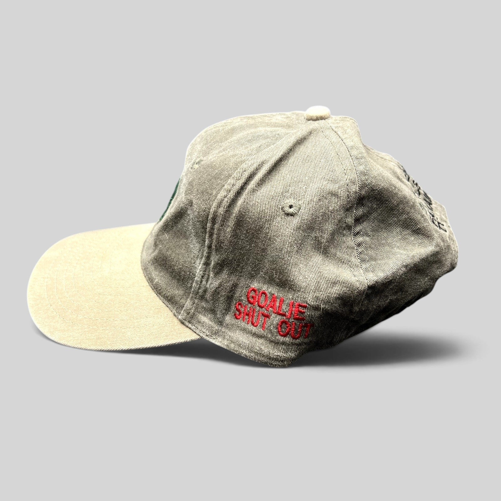 Raree Finds vintage Aspen Fall Face Off hockey strapback hat in olive gray and khaki with Goalie Shut Out embroidery