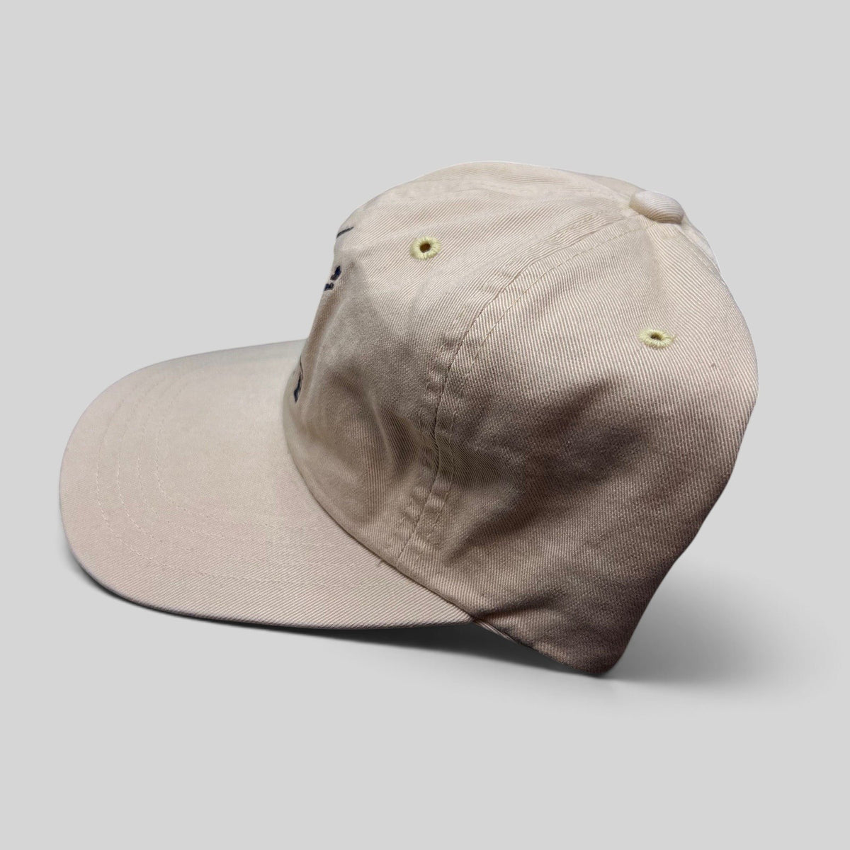 Raree Finds vintage Imperial Rivers Edge cream golf strapback hat with embroidered script and metal pin detail