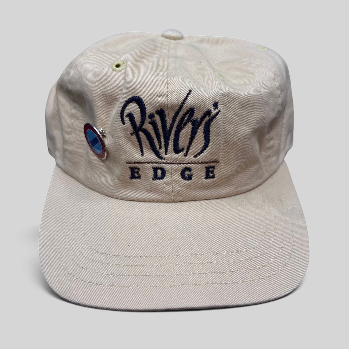 Raree Finds vintage Imperial cream golf strapback hat with Rivers Edge embroidered script logo and metal pin
