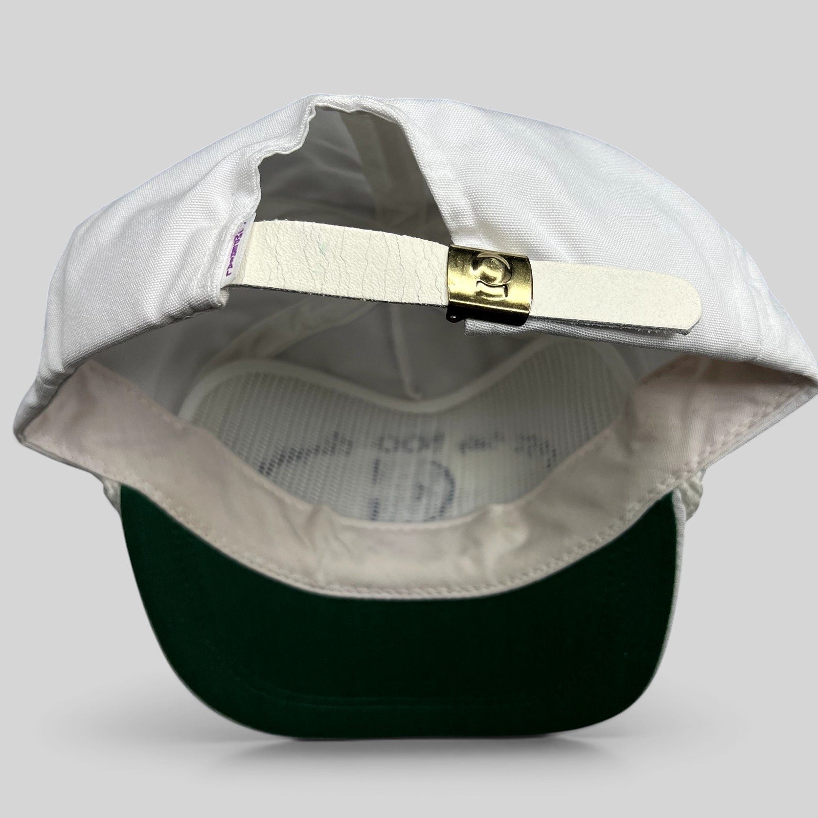 Raree Finds vintage 1987 Indy 500 Cummins Diesel hat showing the white leather strapback and brass clasp closure