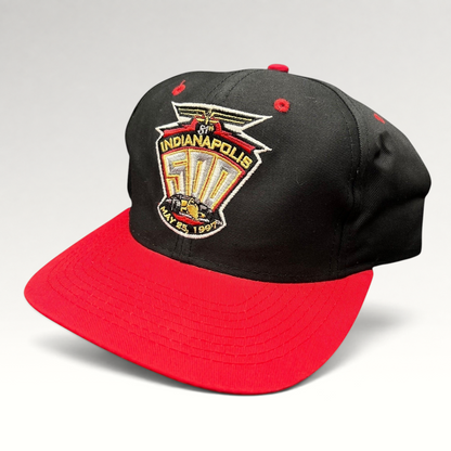 Raree Finds vintage 1997 Indianapolis 500 snapback hat with black crown, red brim, and embroidered race logo.