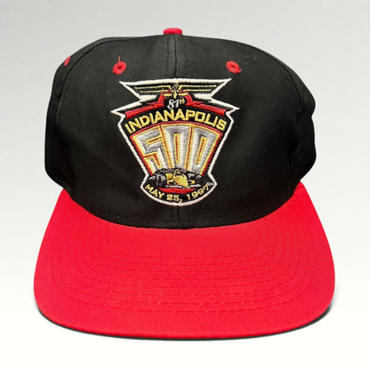 Raree Finds vintage 1997 Indianapolis 500 snapback hat with black crown, red brim, and embroidered racing logo.