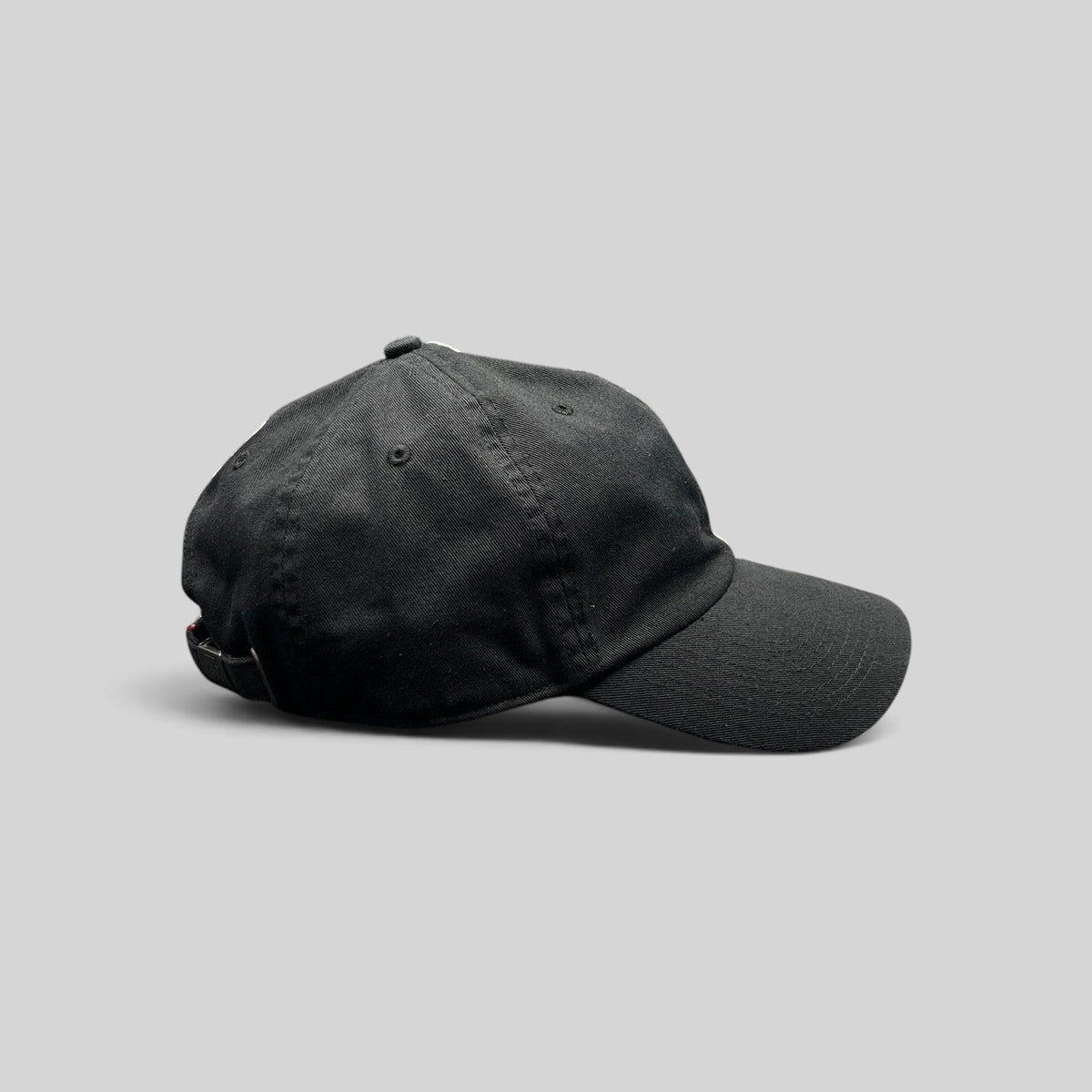 Raree Finds vintage black cotton IndyCar Series strapback hat with adjustable metal closure, side view.