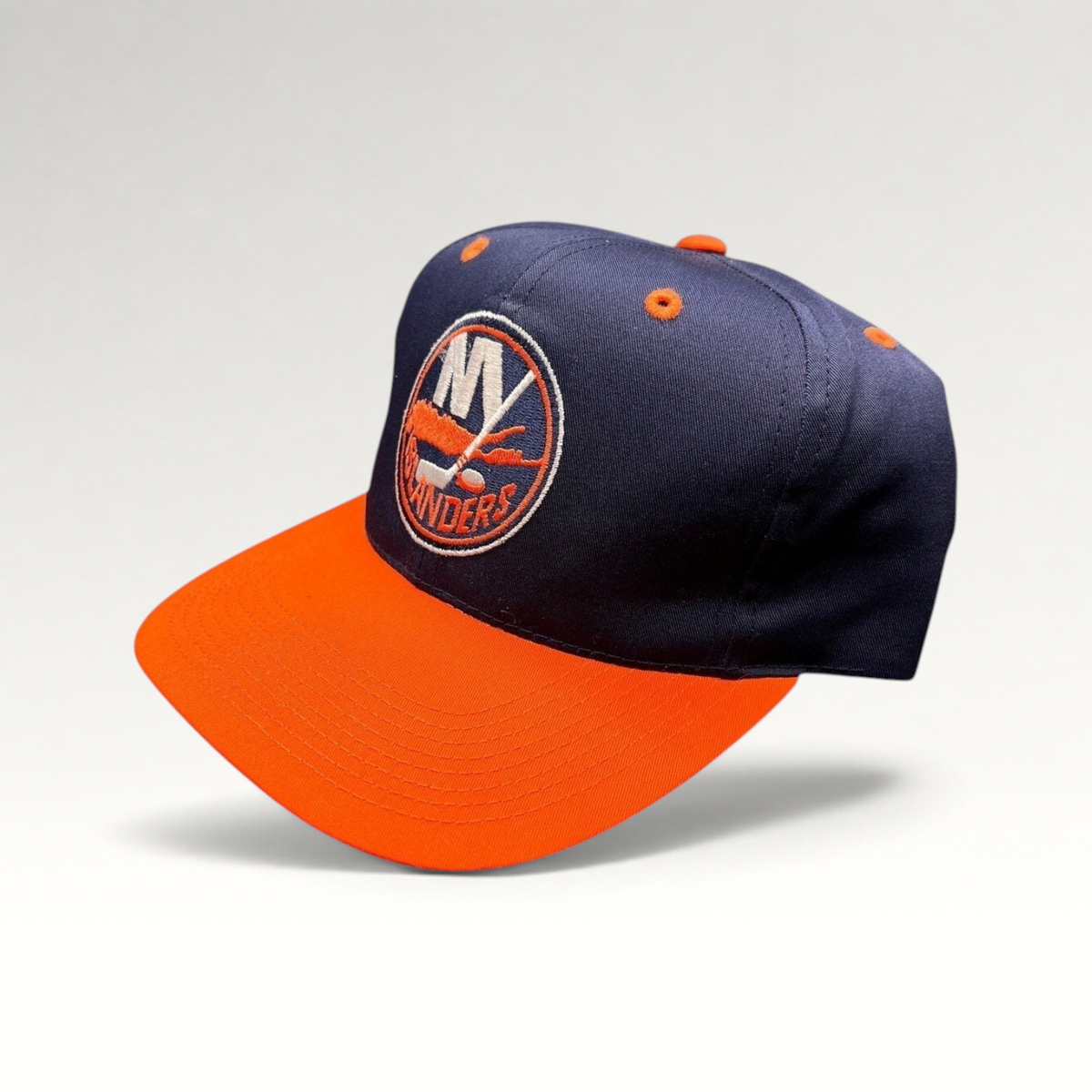Raree Finds vintage 1990s New York Islanders snapback hat in navy and orange with embroidered team logo