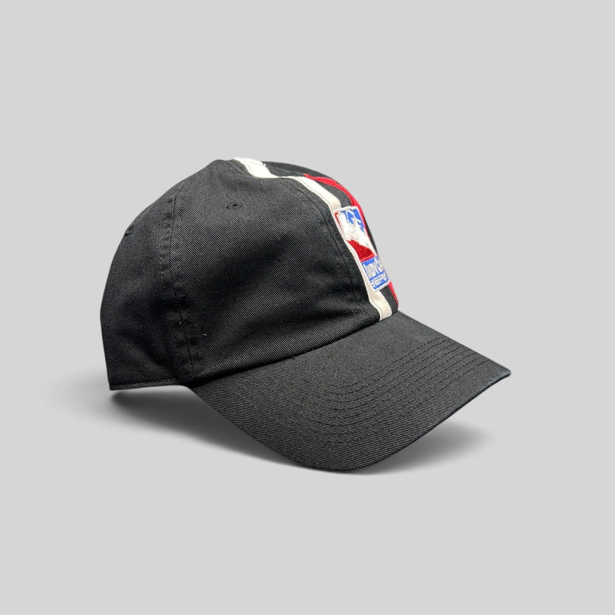 Raree Finds vintage IZOD IndyCar Series black cotton strapback cap with racing stripe embroidery and logo detail.