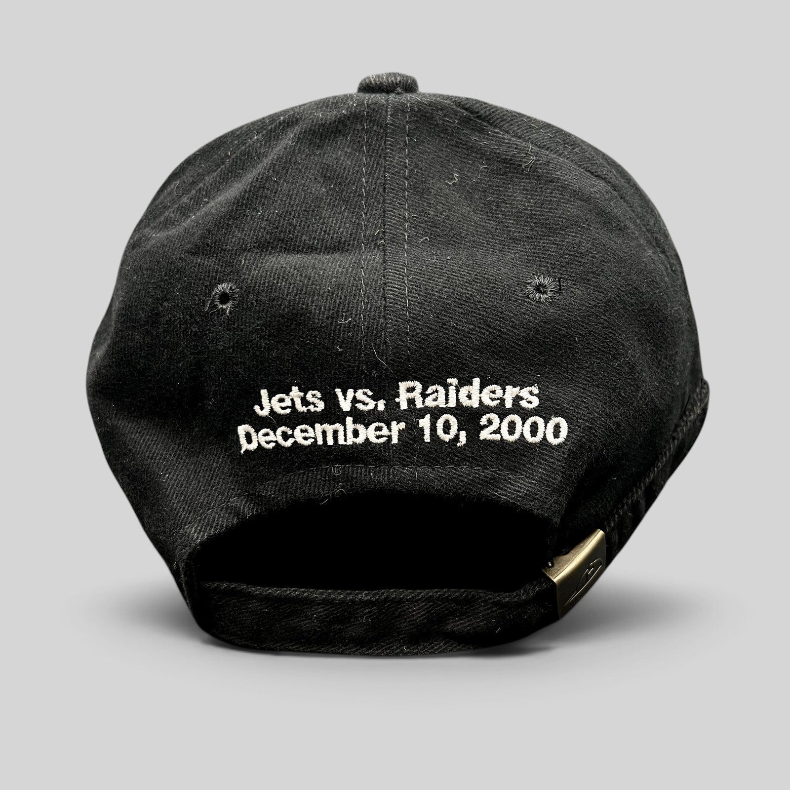 Raree Finds vintage black cotton strapback hat with Jets vs Raiders December 10 2000 embroidery on the back