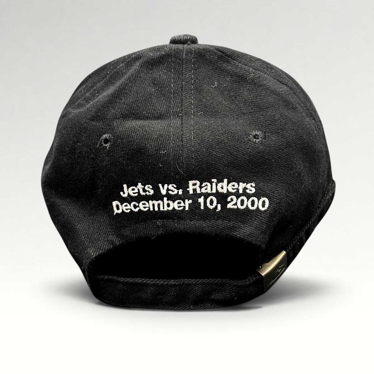 Raree Finds vintage black cotton strapback hat with Jets vs Raiders December 10 2000 embroidery on the back