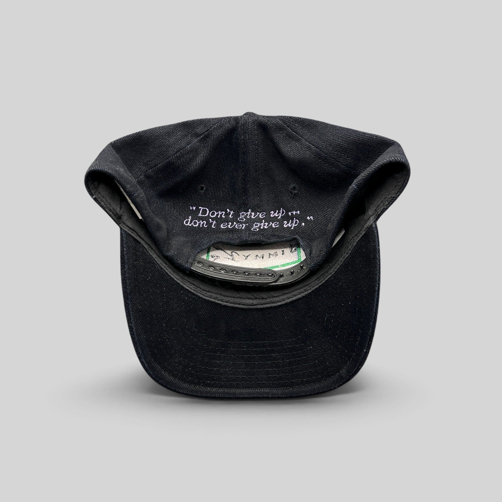 Raree Finds vintage black cotton snapback hat featuring the embroidered Jimmy V quote inside the crown