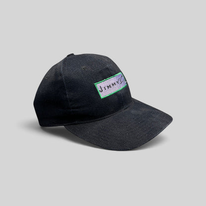 Raree Finds vintage black cotton snapback hat featuring a Jimmy V charity collection logo patch on the front.
