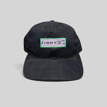 Raree Finds vintage black cotton snapback hat featuring an embroidered Jimmy V charity logo patch on the front.