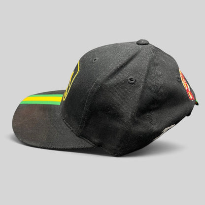 Raree Finds vintage black John Deere NASCAR strapback hat with yellow logo and green and yellow racing stripe brim.