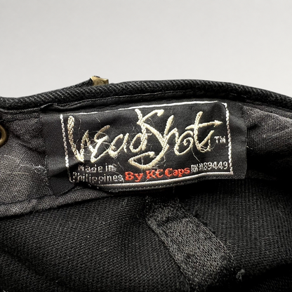 Raree Finds vintage 1990s KC Caps HeadShots label inside a black cotton Sandeman Port wine promotional hat