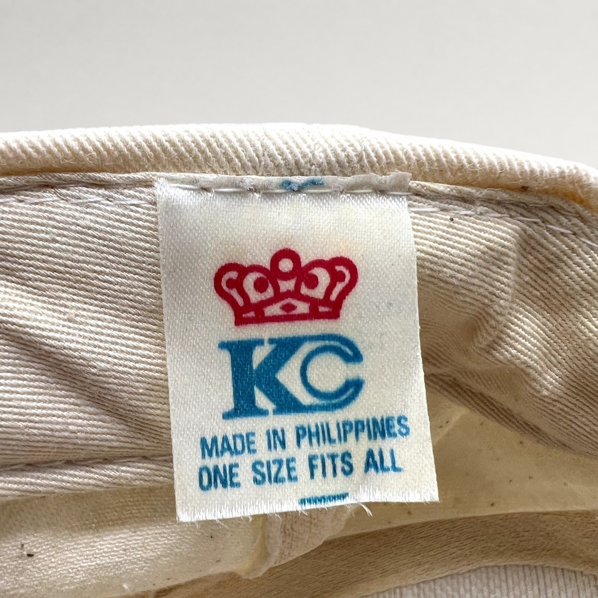 Raree Finds vintage KC brand clothing tag inside a cream colored snapback hat made in the Philippines